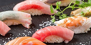 Omakase Nigiri Set: A selection of 10 crafted nigiri, accompanied by chawanmushi and miso soup.