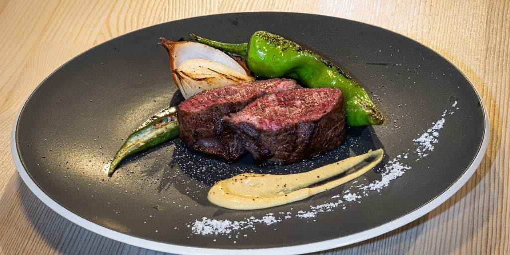 A course featuring a complimentary glass for a toast, including locally sourced oysters and fresh fish, and all the delights of premium black wagyu beef.