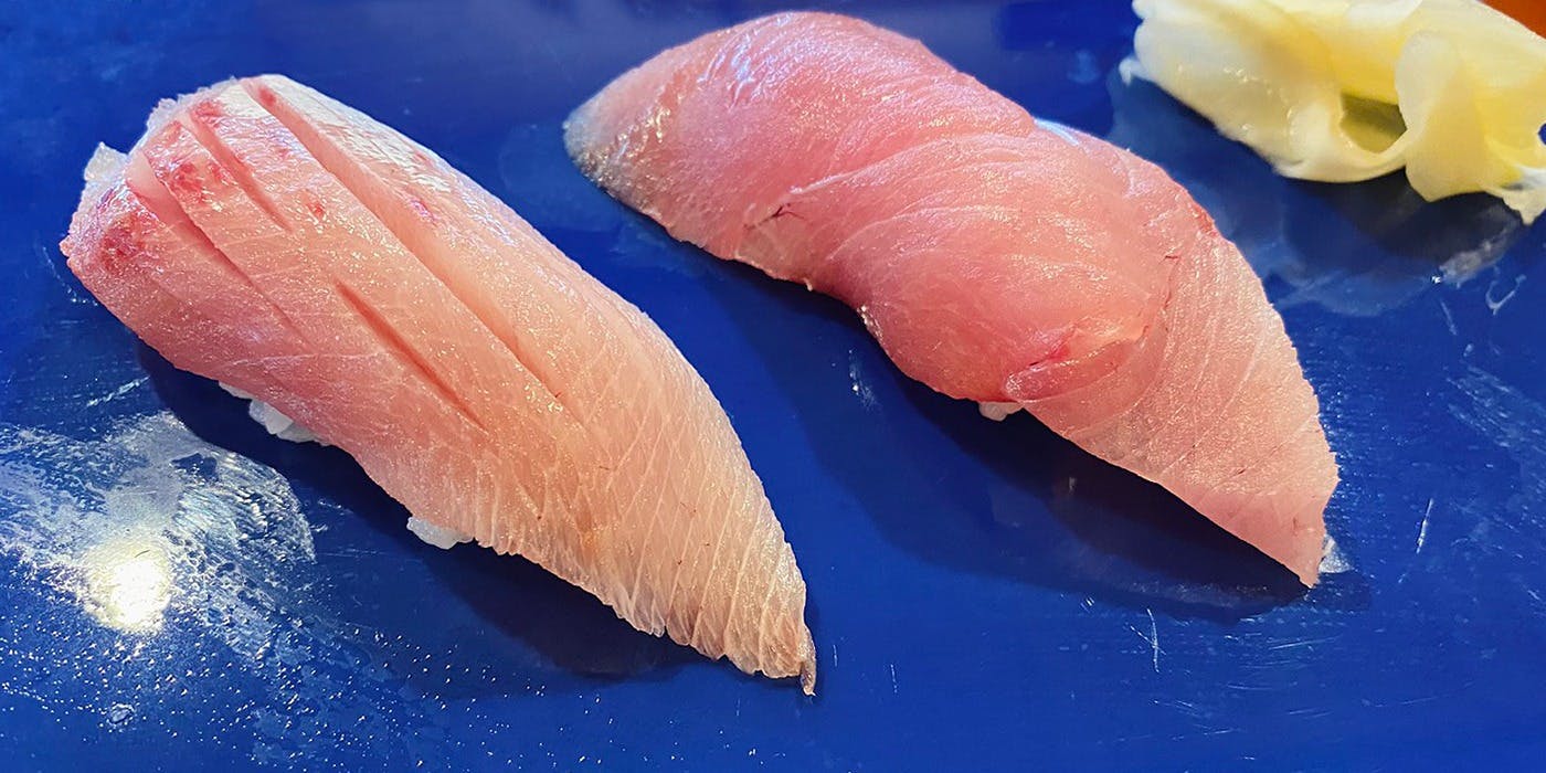 A course featuring an abundant selection of dishes, including sashimi, grilled items, and simmered dishes